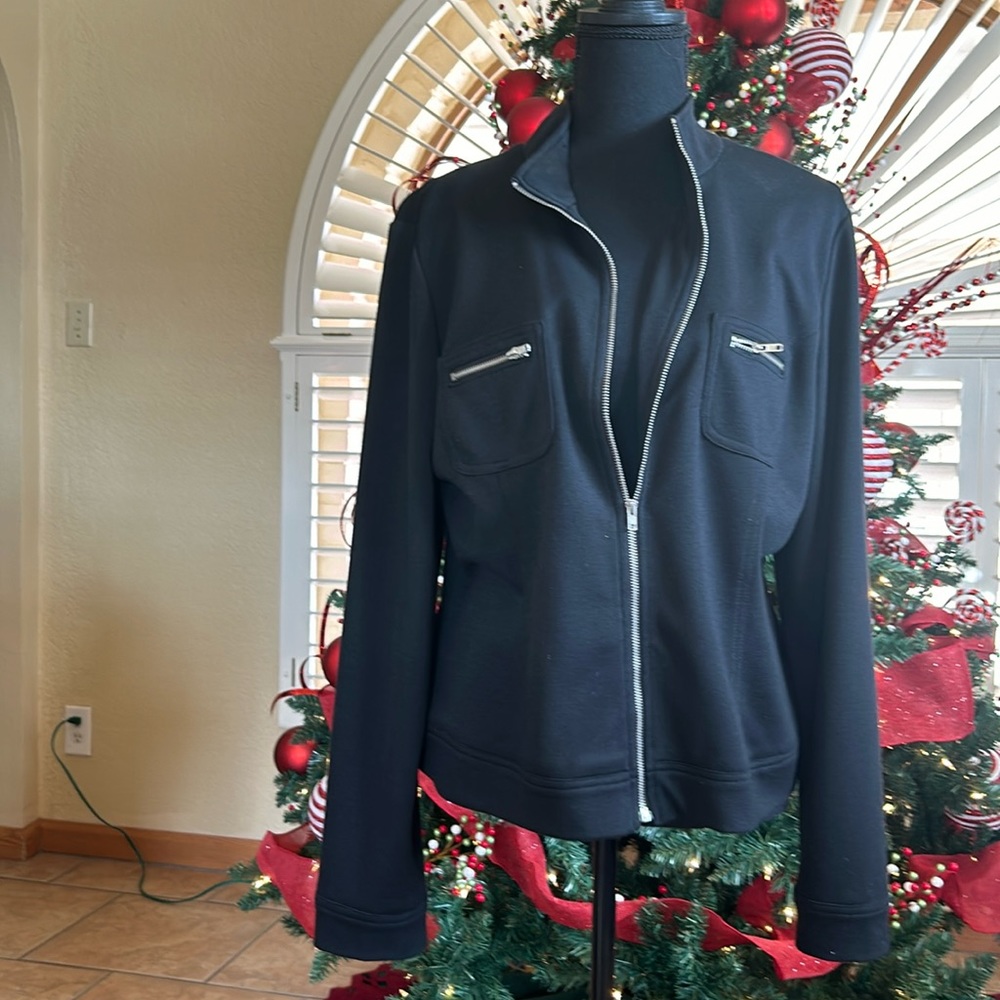 Black light jacket.  Size 16 Zippered front and zippered pockets.